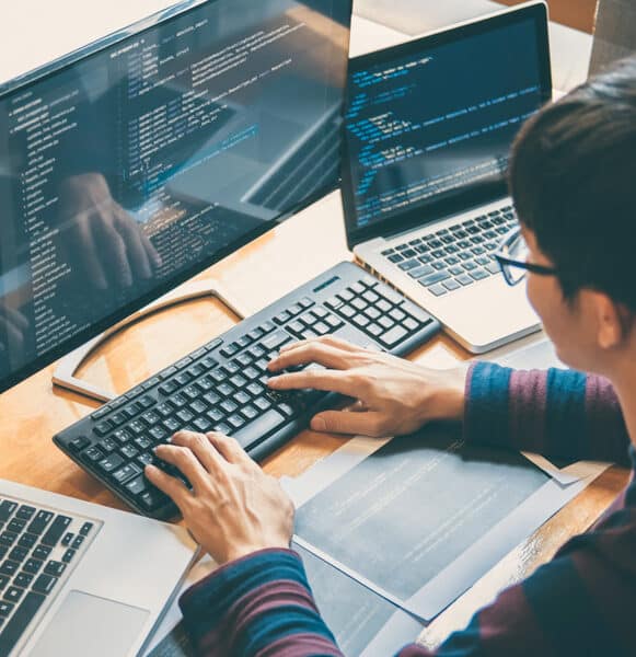 it specialist typing on a computer