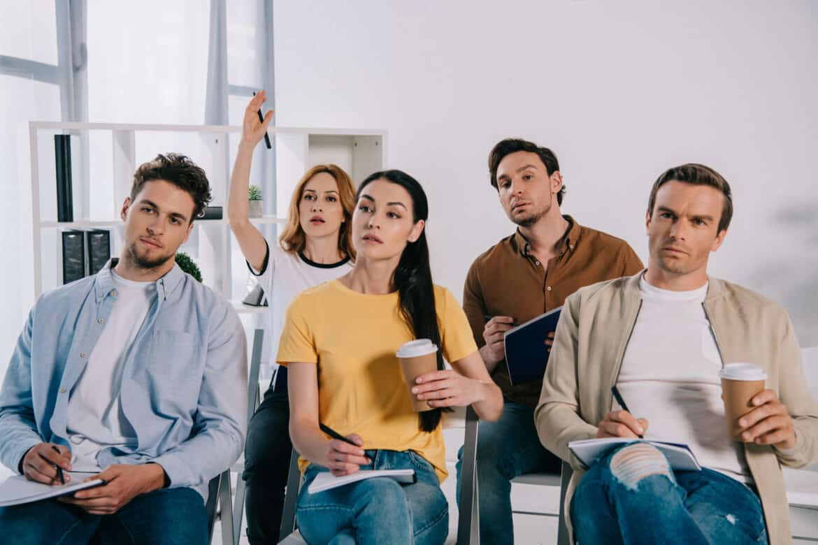 group of student taking notes during lecture