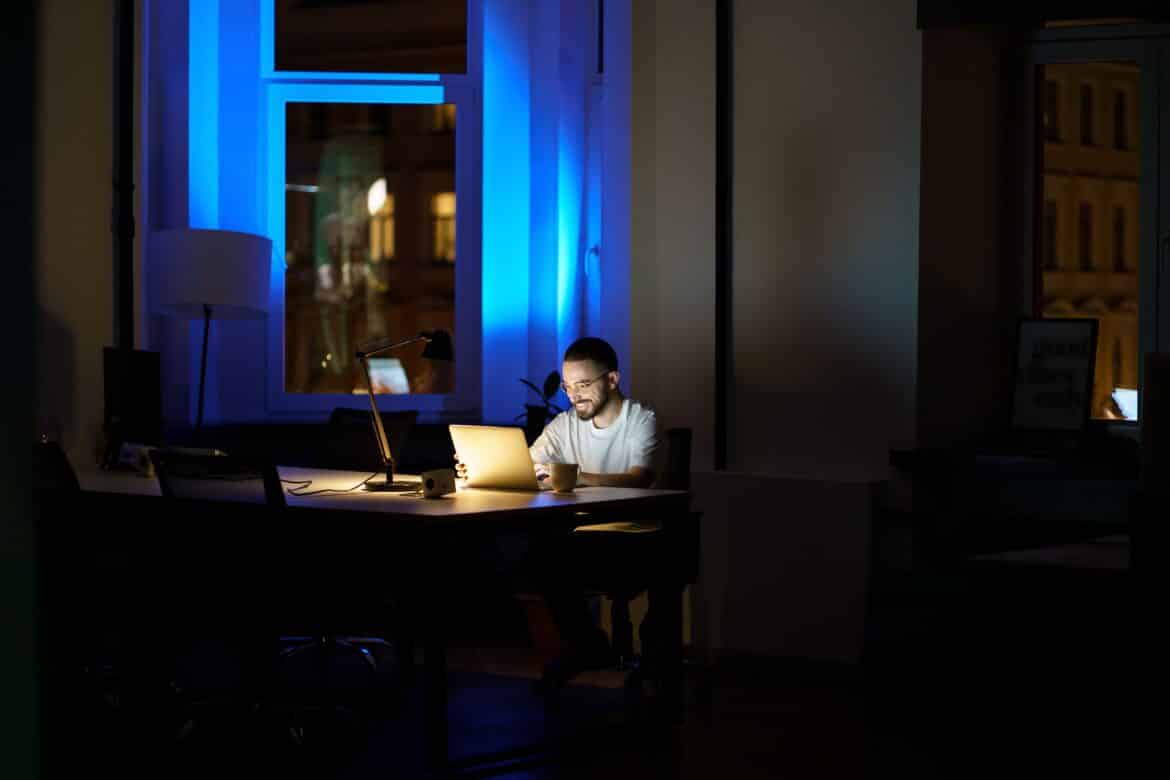 Man researching IT company at his house