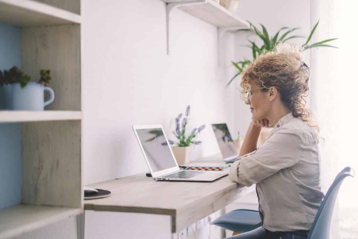 woman working on a computer, IT compliance